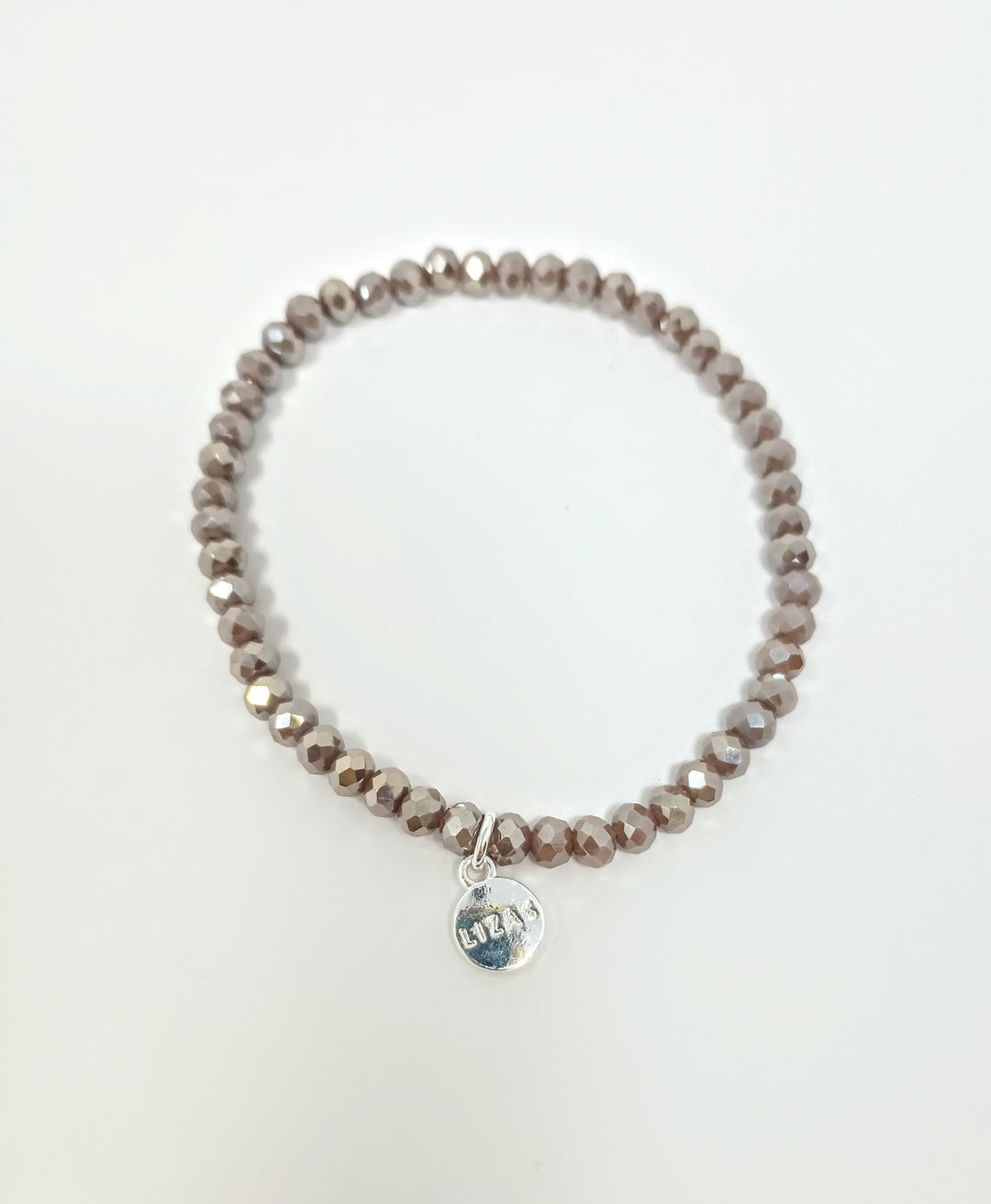 Stretchy bracelet with faceted glass beads in a colorful beaded pattern.