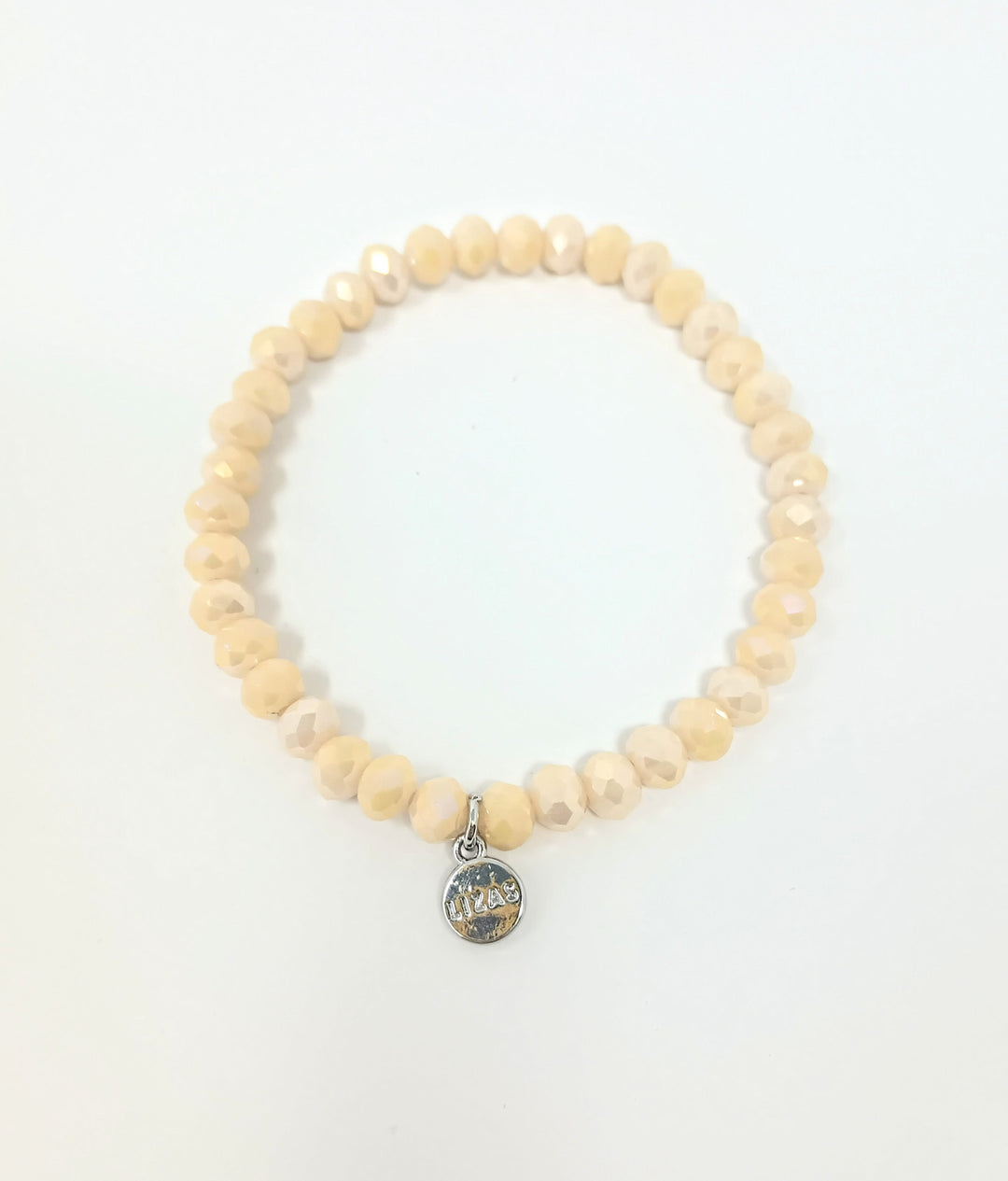 Stretchy bracelet with faceted glass beads in a colorful beaded pattern.