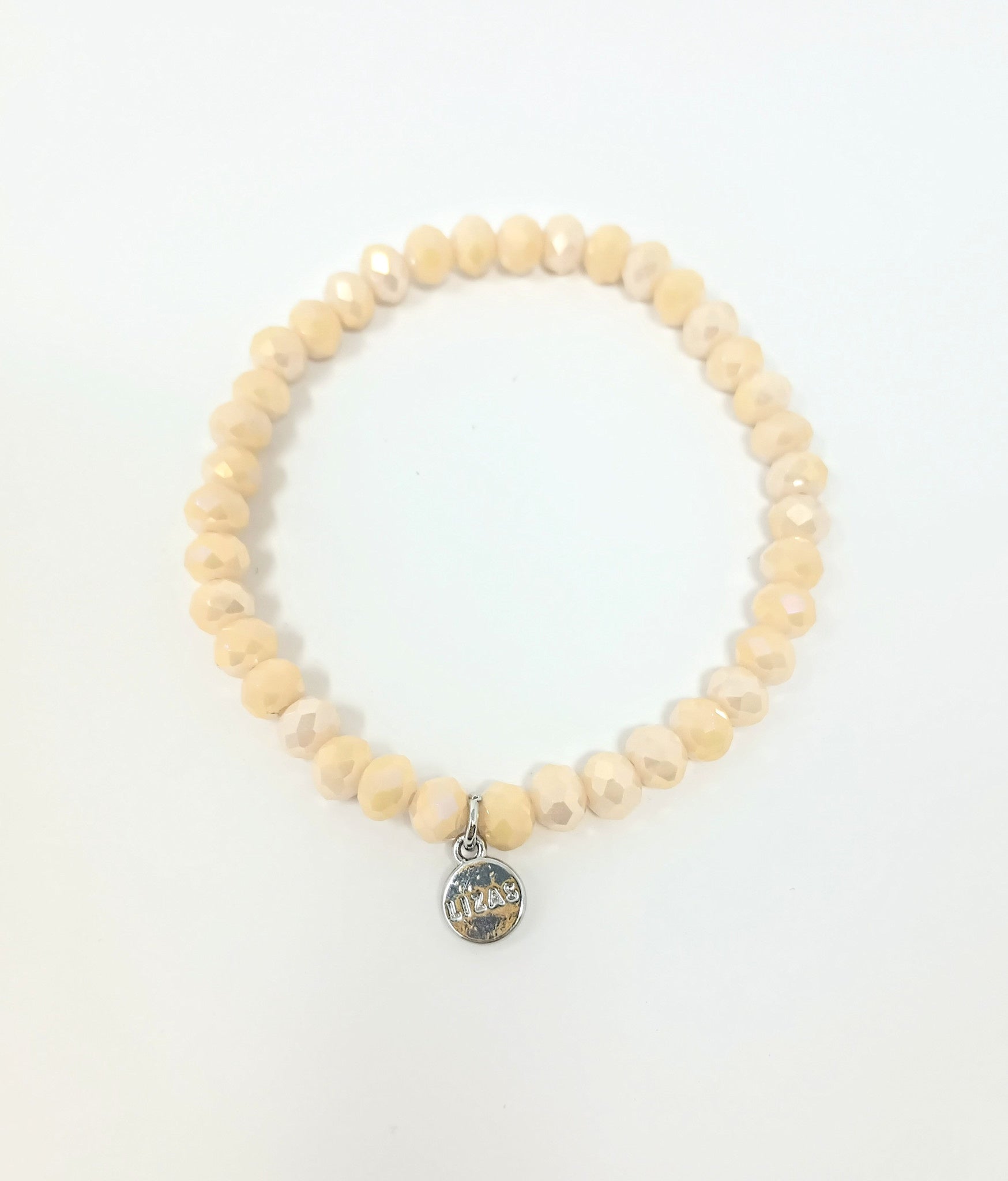Stretchy bracelet with faceted glass beads in a colorful beaded pattern.