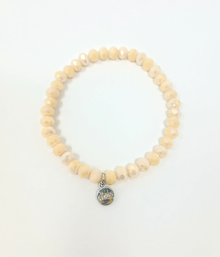 Stretchy bracelet with faceted glass beads in a colorful beaded pattern.