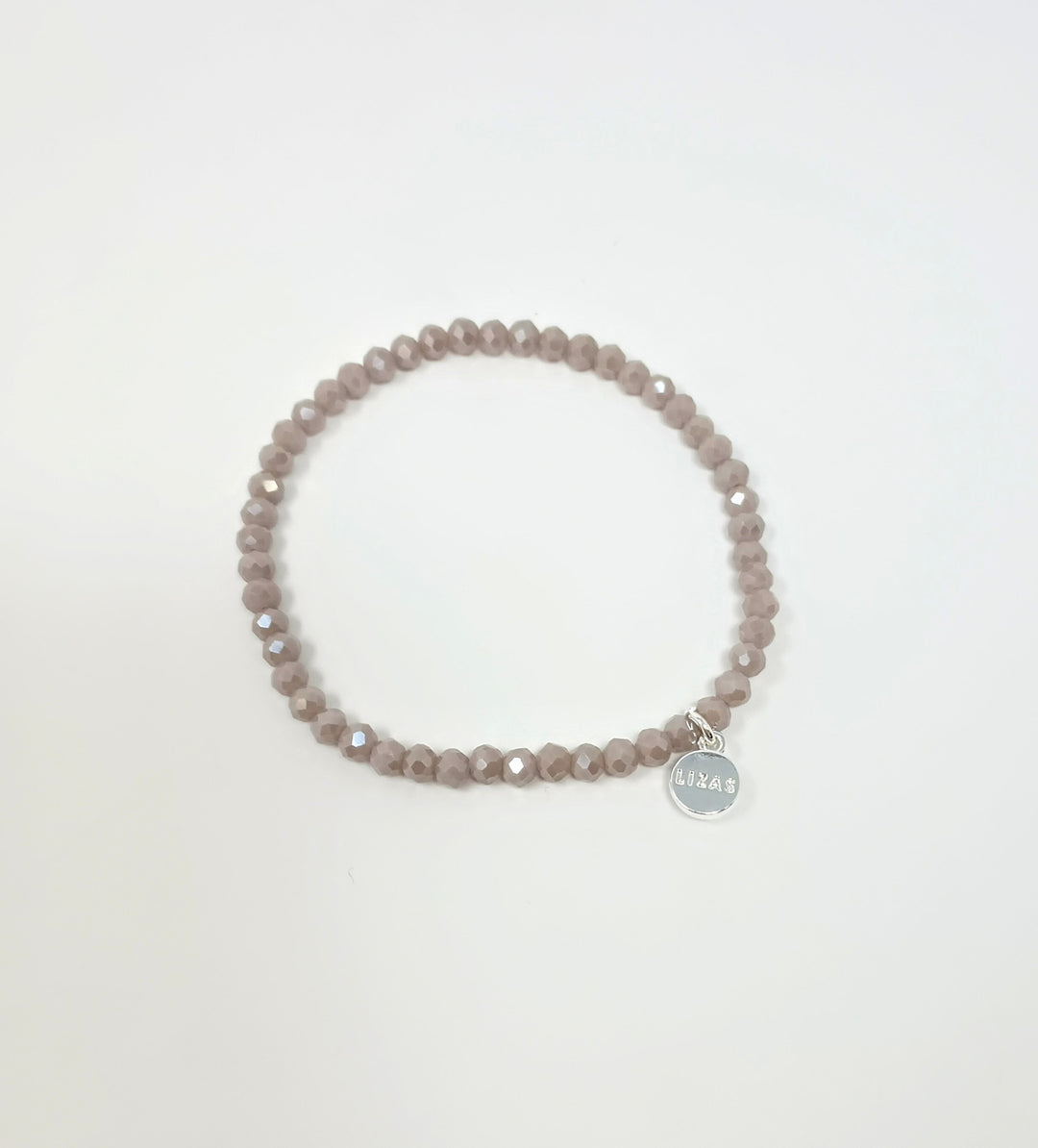 Stretchy bracelet with faceted glass beads in mixed colors on a white background.