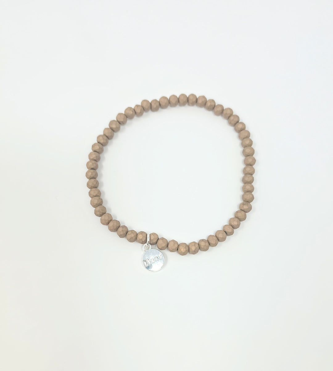 Stretchy bracelet with faceted glass beads in a colorful beaded pattern.