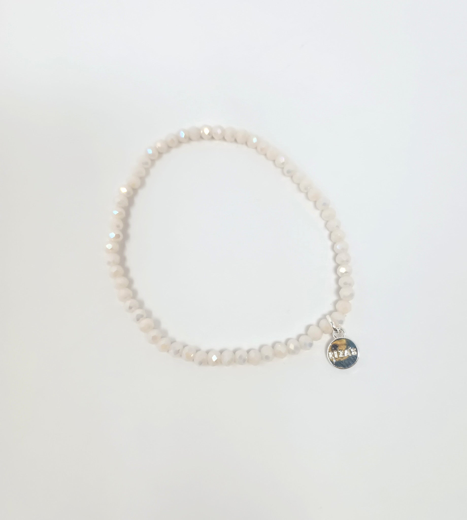 Stretchy beaded bracelet with faceted glass beads in a colorful pattern.
