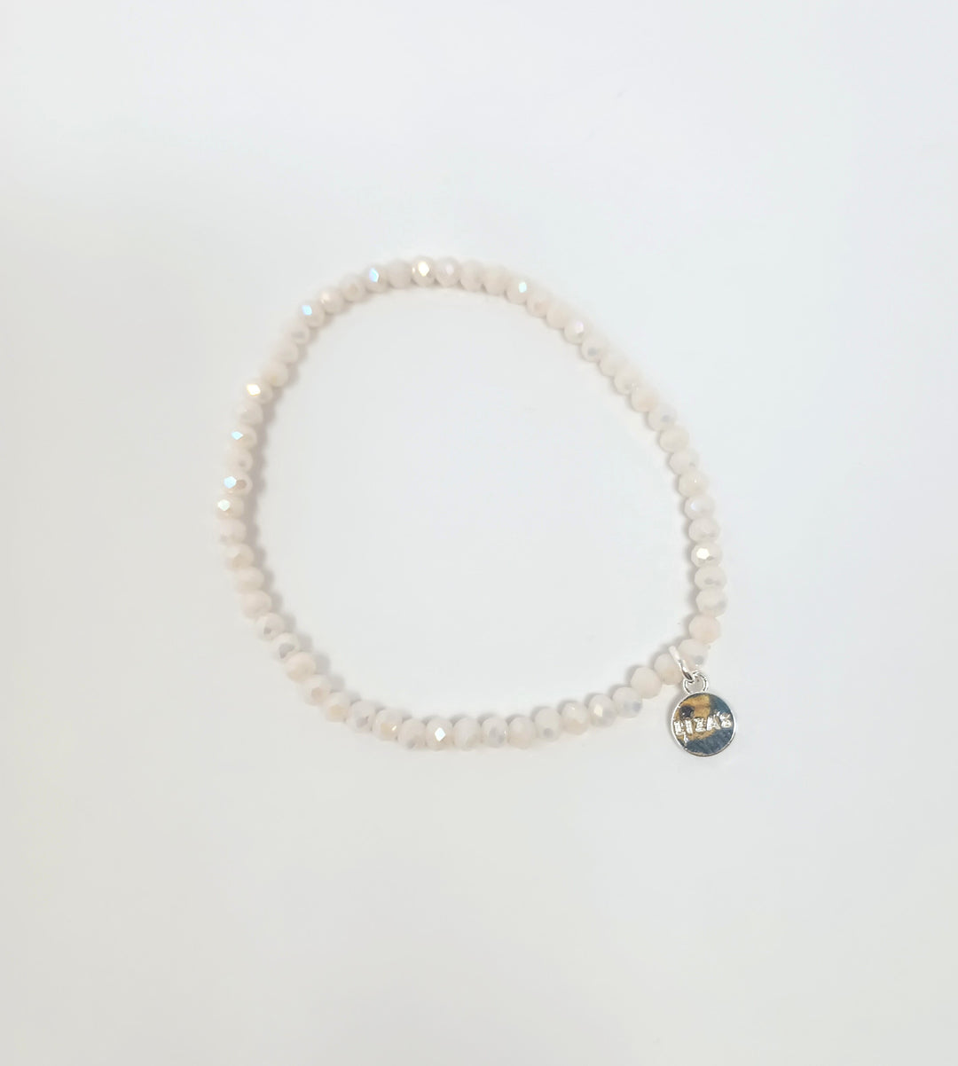 Stretchy beaded bracelet with faceted glass beads in a colorful pattern.