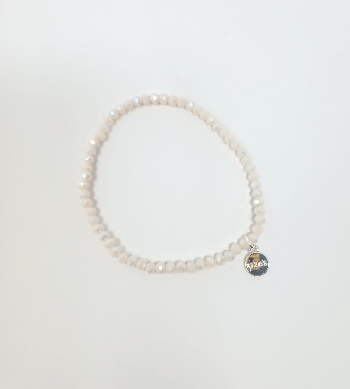 Stretchy beaded bracelet with faceted glass beads in a colorful pattern.