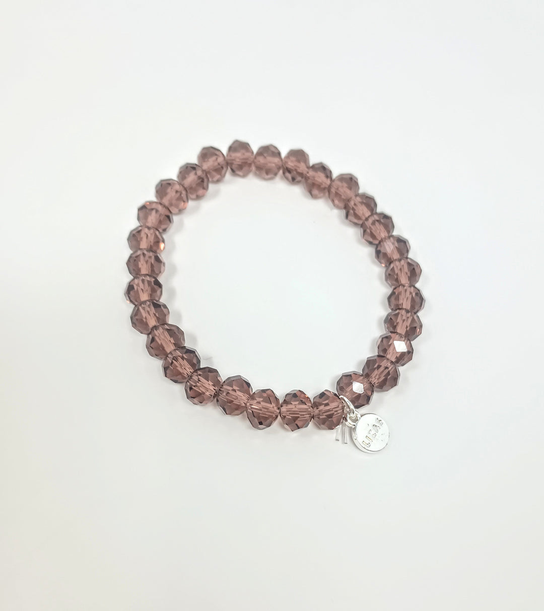 Stretchy bracelet with faceted glass beads in a colorful beaded pattern.
