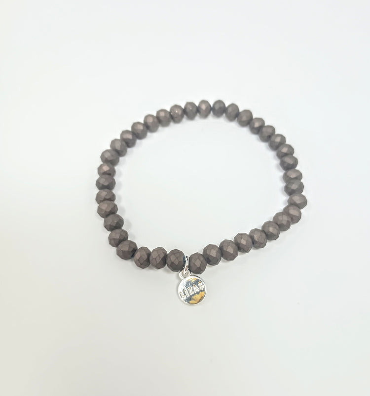 Stretchy bracelet with faceted glass beads in vibrant colors.