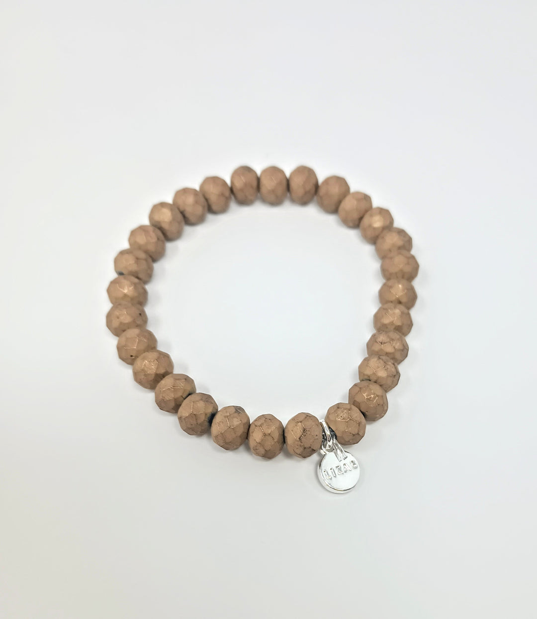 Stretchy bracelet with faceted glass beads in a colorful beaded pattern.