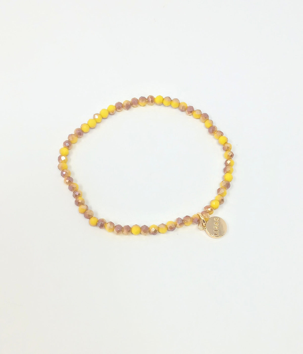 Stretchy bracelet with faceted glass beads in a colorful beaded pattern.