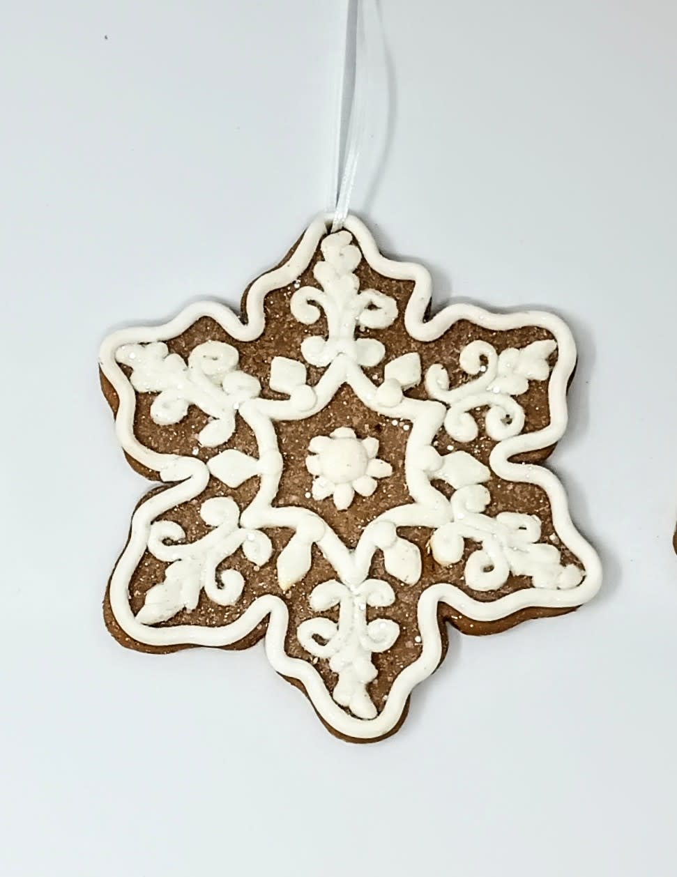 4.75-inch gingerbread man clay dough ornament with classic brown color.