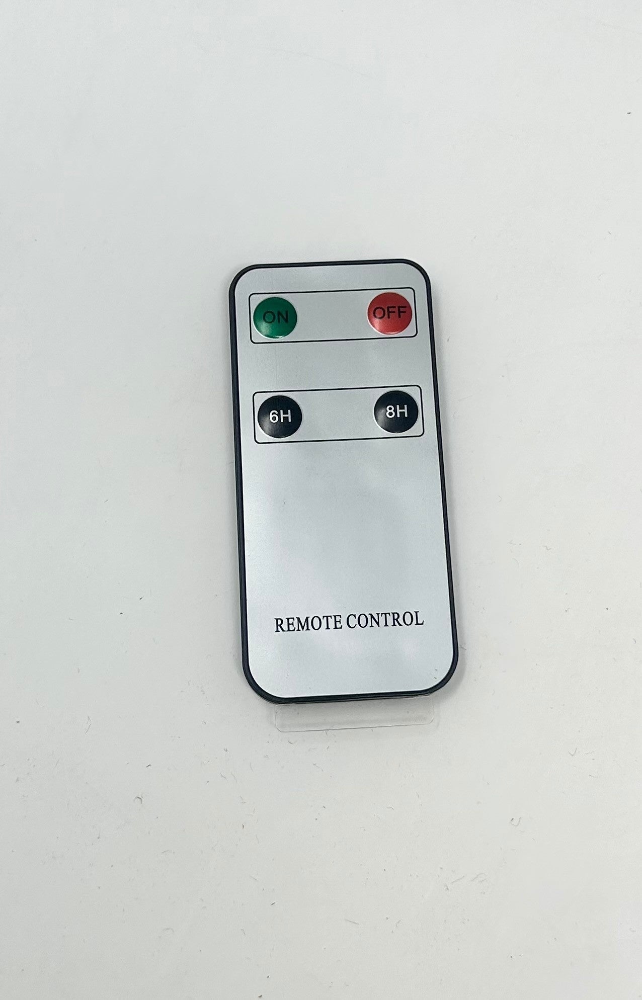 Silver rectangular remote control with four buttons labeled ON, OFF, 6H, and 8H.