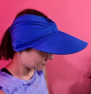 Women's bright colored open-top sun visor hat with wide brim and elasticized chinlon fabric