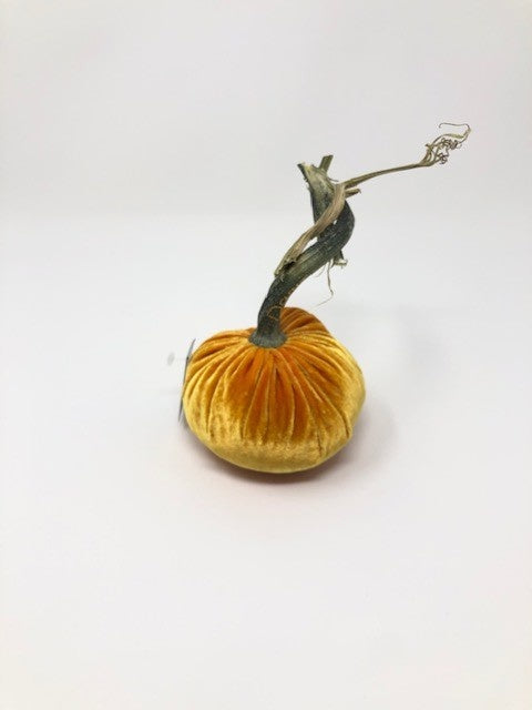 Handmade orange velvet pumpkin with a natural stem.