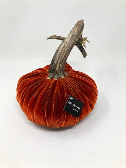 Handmade velvet pumpkin in deep orange with a natural stem.