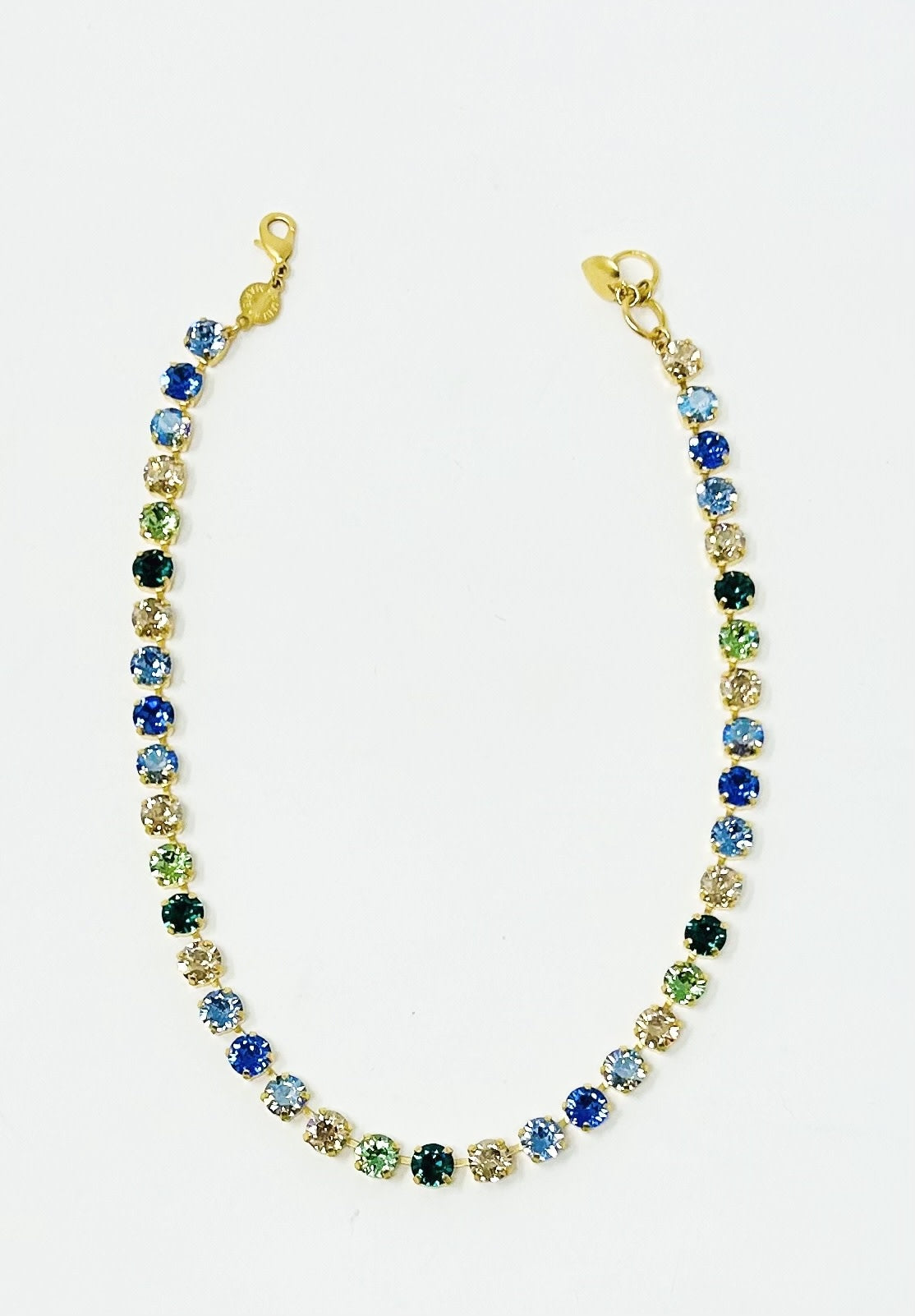 Gold classic necklace featuring an amber tag with a crystal and Scotty dog heart charm.