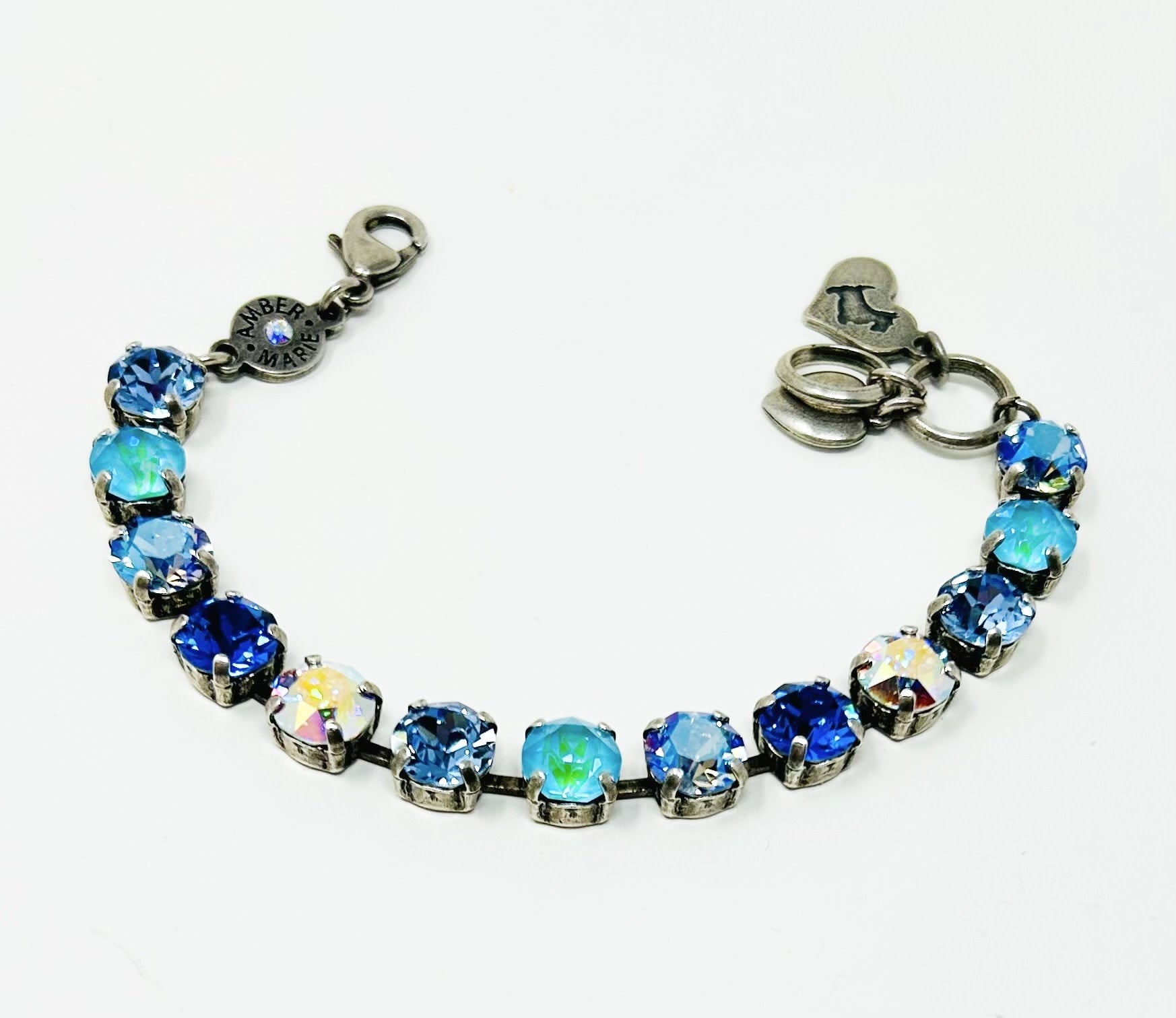 Classic Santorini bracelet featuring blue ombre Czech crystals, an amber tag with a crystal, and a Scotty dog heart charm.