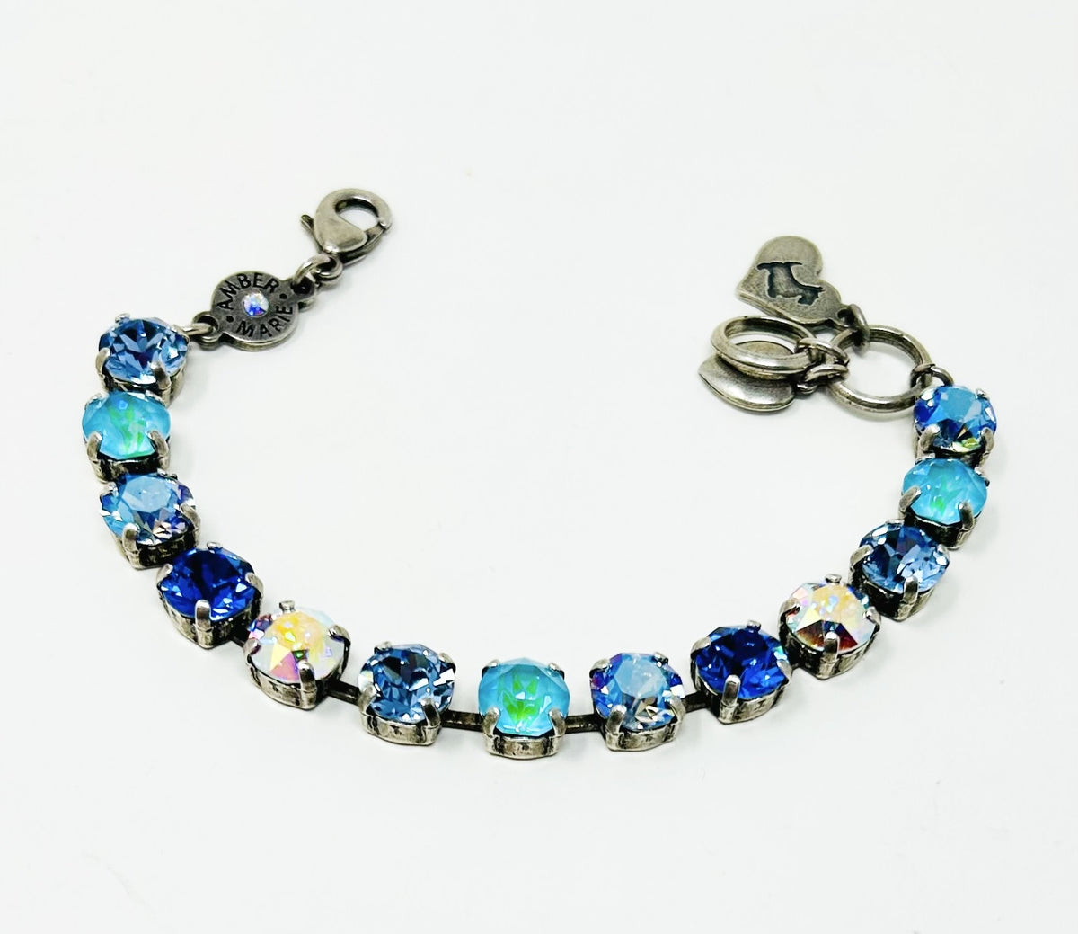 Classic Santorini bracelet featuring blue ombre Czech crystals, an amber tag with a crystal, and a Scotty dog heart charm.
