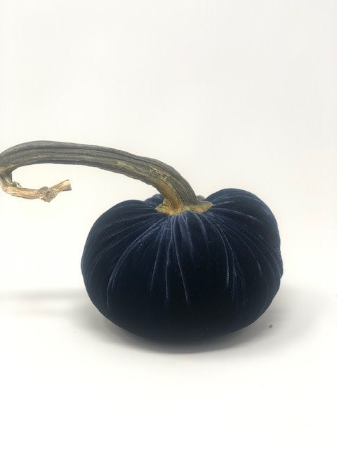 Handmade orange velvet pumpkin with a natural stem.