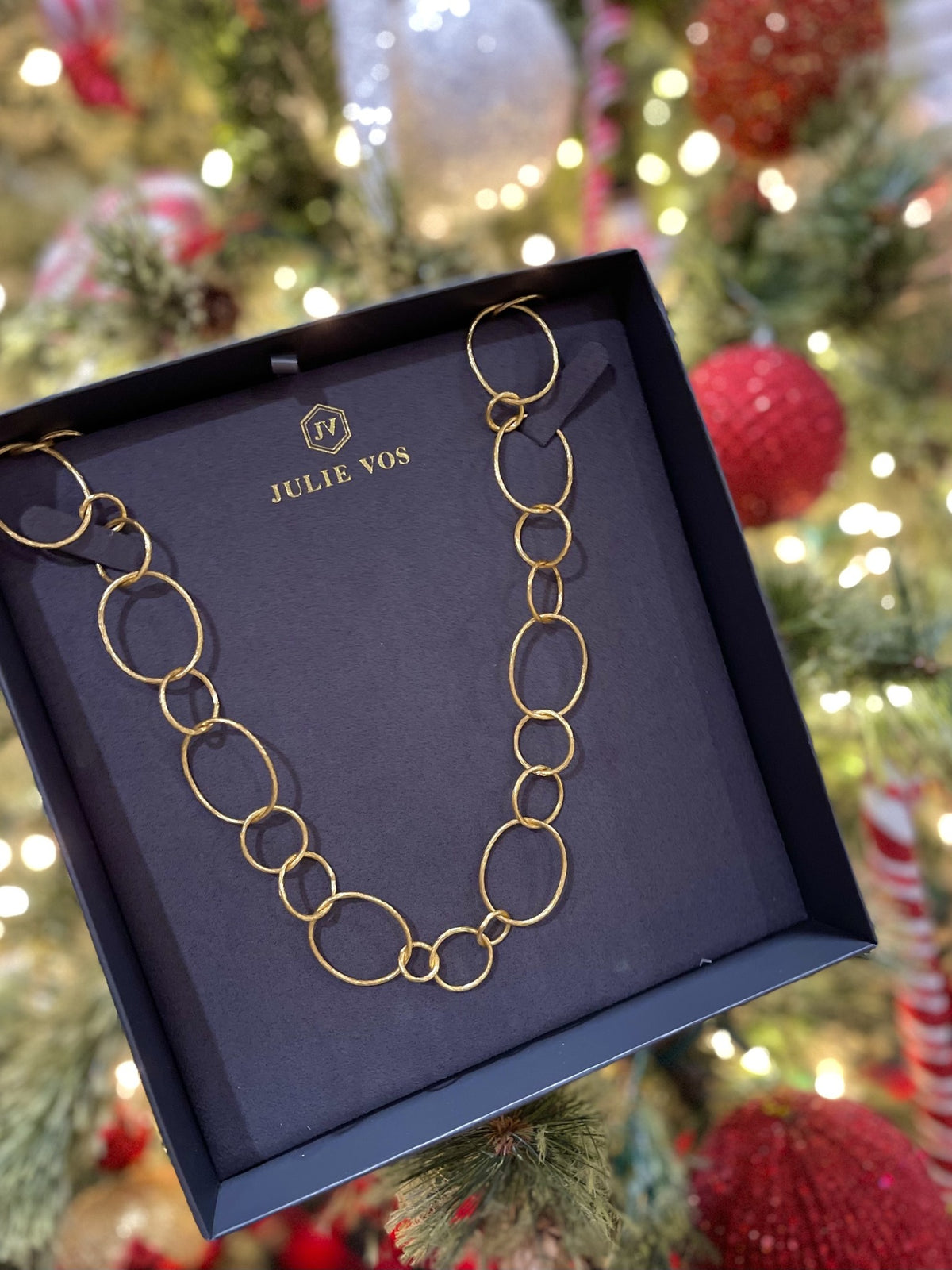 Gold textured necklace with varying loop sizes, 36-inch length featuring a golden etched finish and Julie Vos hallmark.