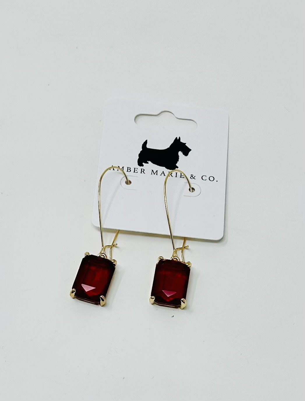 Rectangle drop earrings featuring a sleek geometric silhouette in solid black with polished metal hooks.