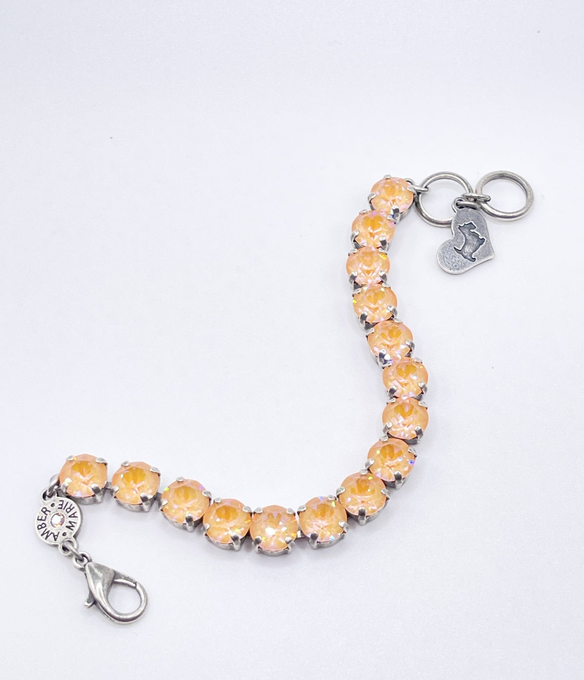 Adjustable silver-tone bracelet featuring a Scotty dog heart charm