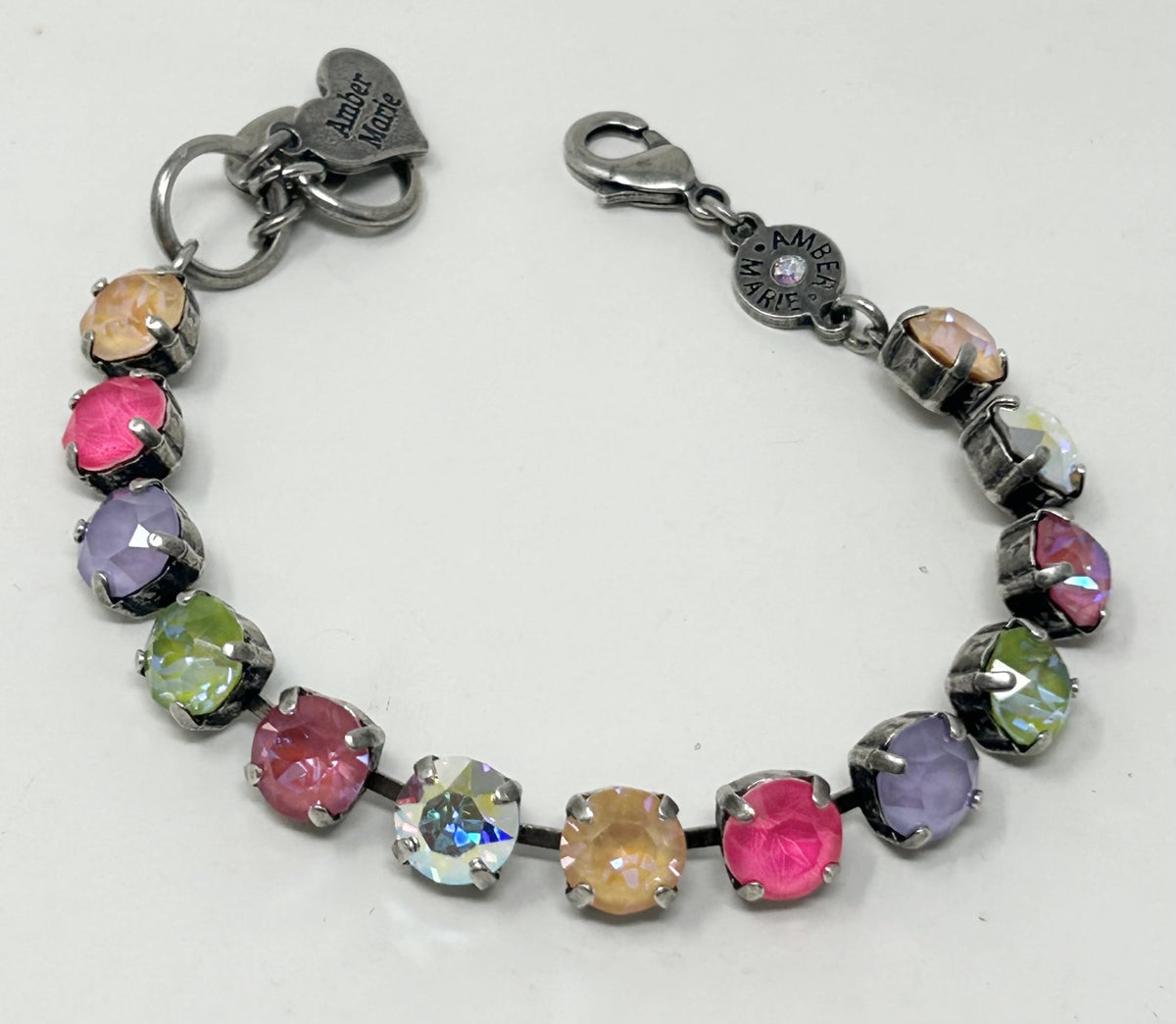 Classic Malibu bracelet featuring lavender, lilac, white, and light green stones with an amber tag heart charm.