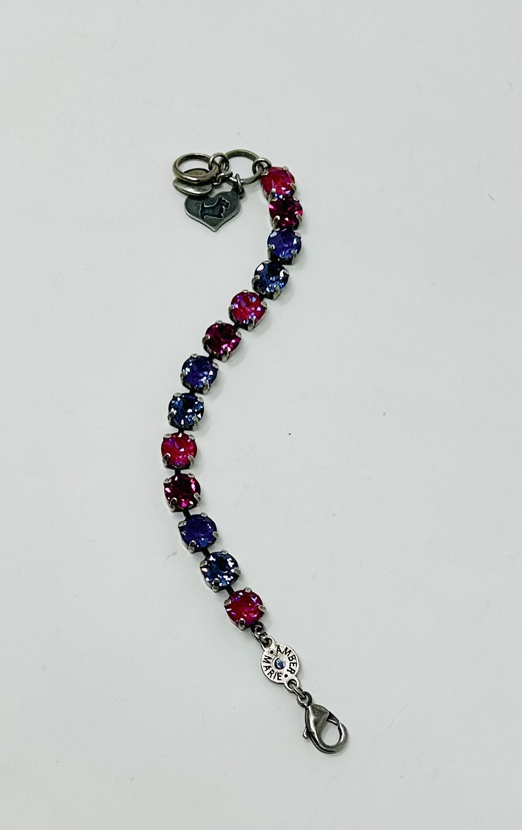 Milan bracelet featuring alternating pink and purple round crystals on a silver-tone chain.