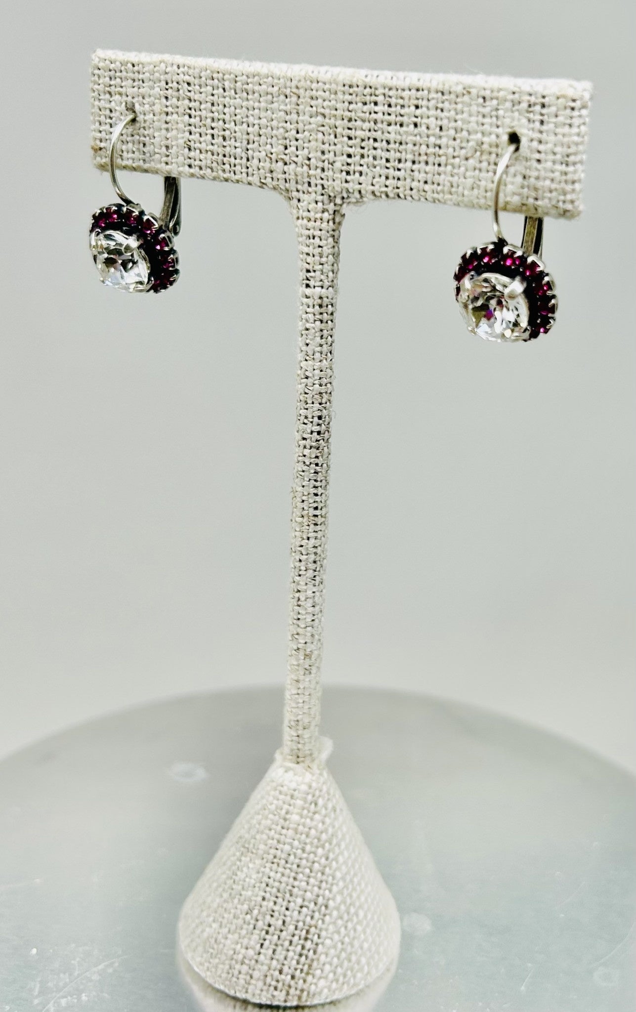 Silver fuchsia stone pave earrings with a stud silhouette