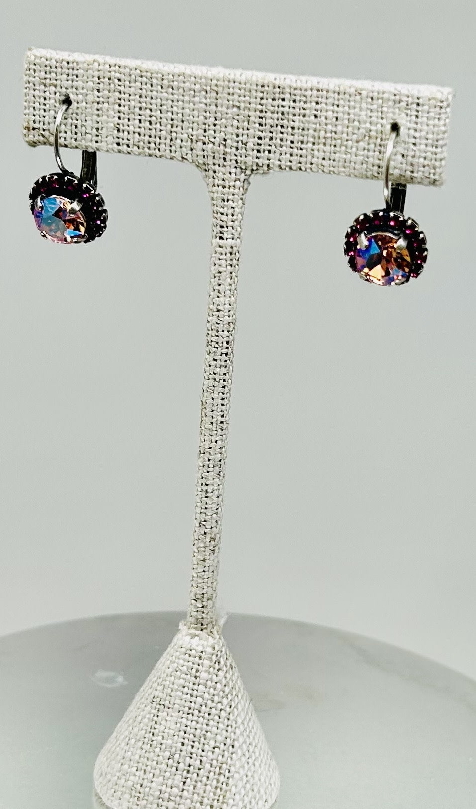 Silver earrings featuring a fuchsia stone pave setting with an elegant stud silhouette.