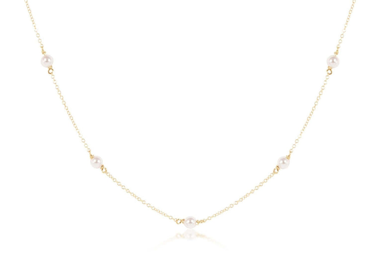 Gold-filled choker necklace featuring a delicate chain with four-millimeter pearls