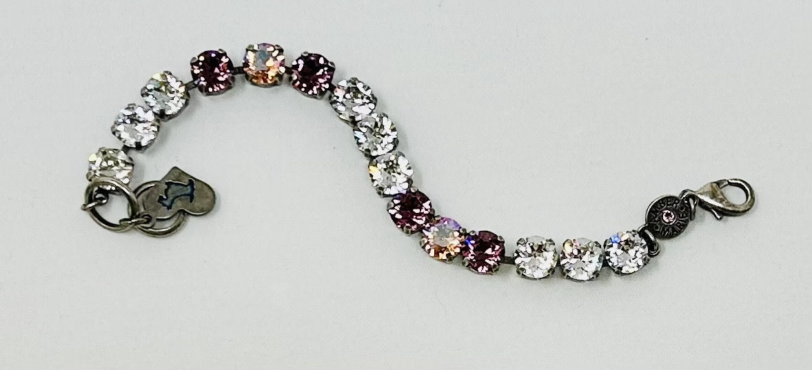 Classic Bracelet in lavender, lilac, white, and light green crystals with an amber tag heart charm.