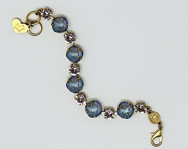 Gold Premier Bracelet Paris featuring a sleek gold-tone chain with an elegant pendant.