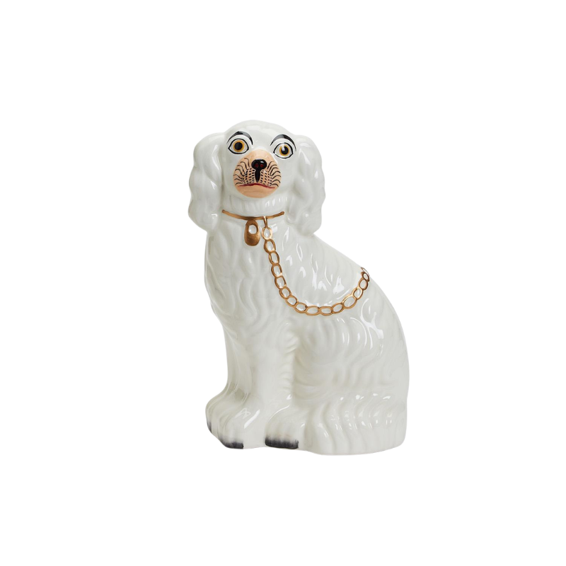 White ceramic Staffordshire dog statue with gold collar and chain detail.