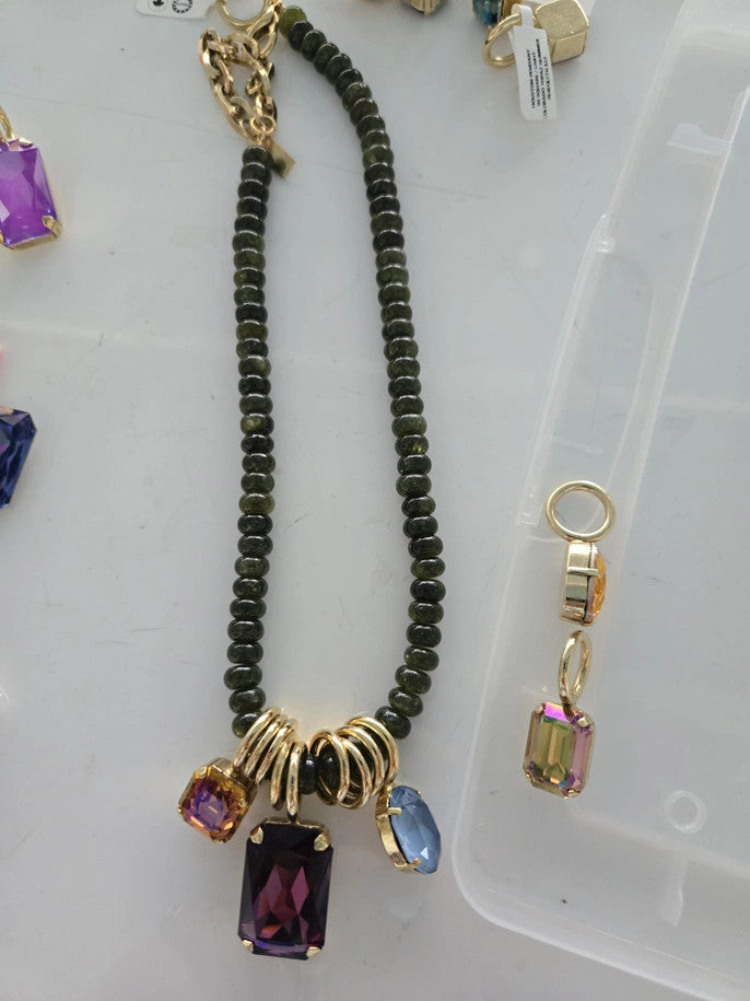 Antique gold plated brass necklace with high quality crystals and beads on a 16-inch chain.