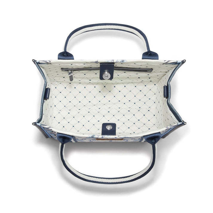 Indigo Song Bird canvas tote with white background featuring floral patterns and songbird artwork.