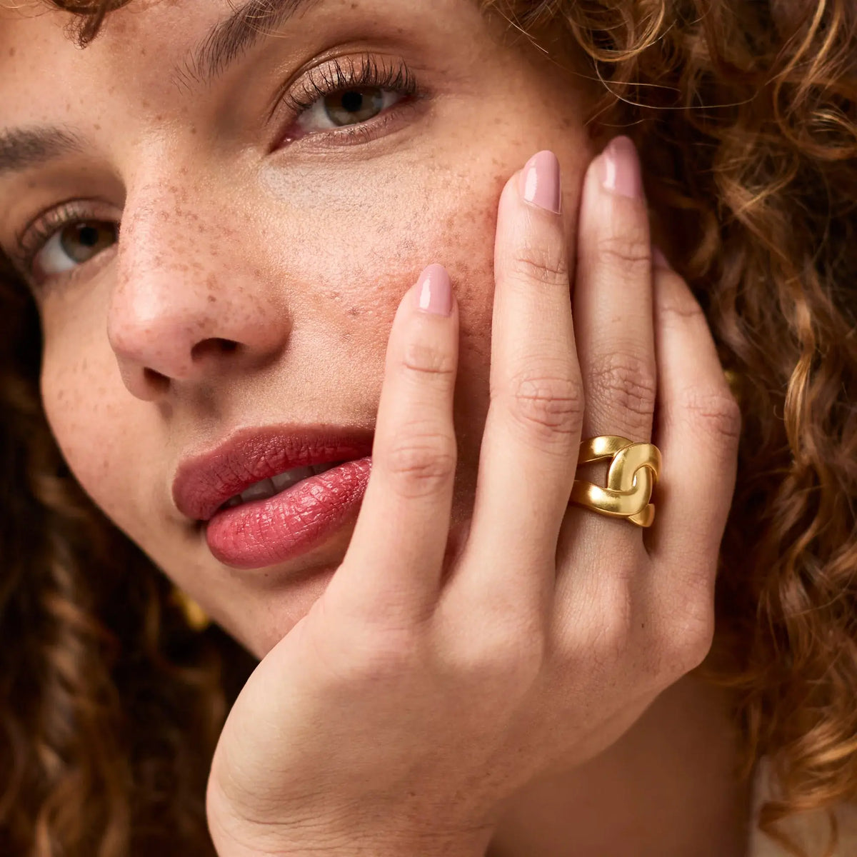 Sleek Infinity Ring with continuous band design in gold-tone finish