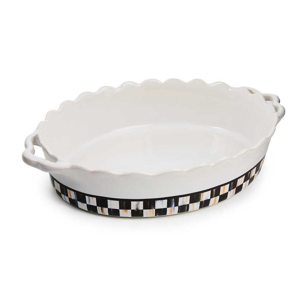 Oval stoneware baking dish with handle in natural earth tones