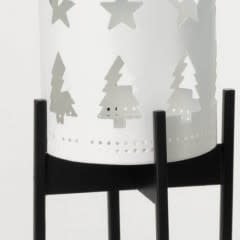 White ceramic candleholder with cutout geometric patterns