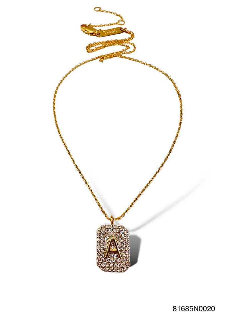 Gold initial pave tag necklace pendant with a sparkling pavé-set letter on a sleek rectangular bar.