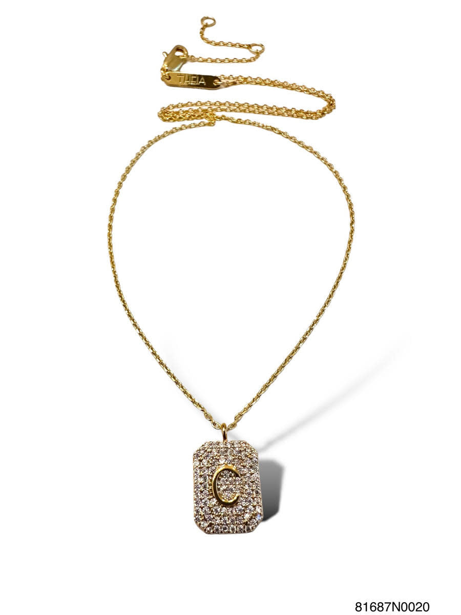 Gold initial pave tag necklace pendant with sparkling pavé-set letter on sleek rectangular silhouette.