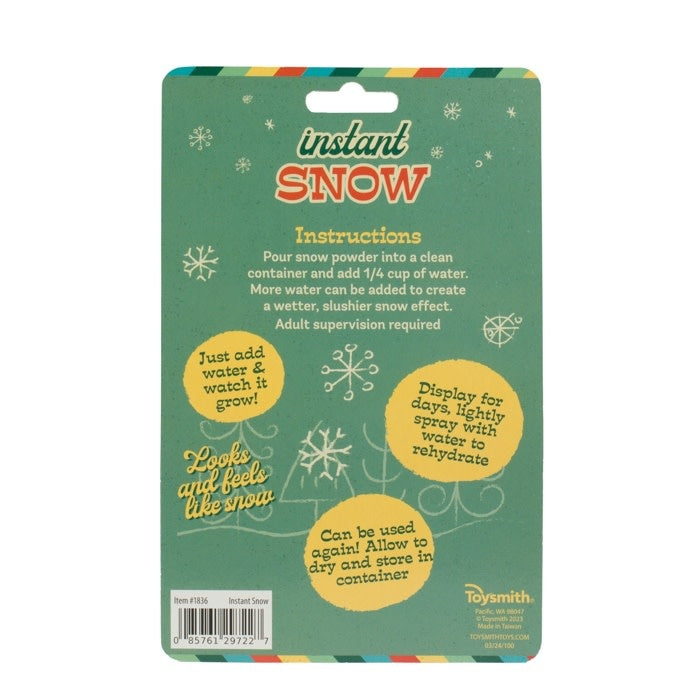 Plastic tube containing white fake snow powder with water activation instructions.