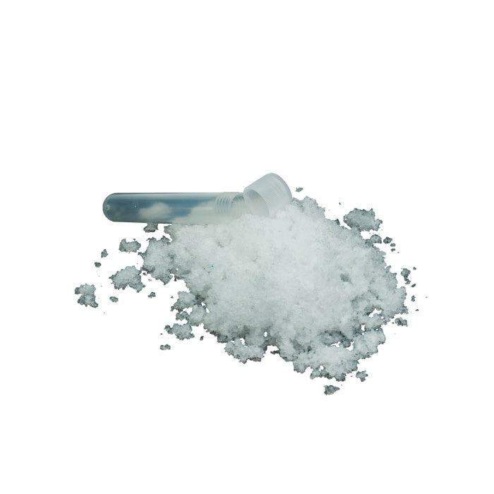 Plastic tube filled with white fake snow powder for instant indoor winter play.