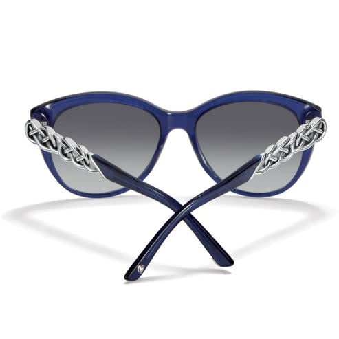 Cat eye sunglasses with silver-plated temples featuring an Interlok braid pattern in blue and silver tones.