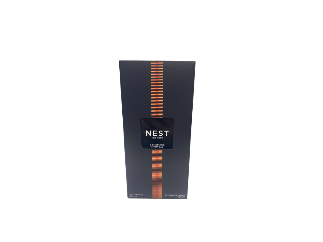 Nest New York Something Tropical Reed Diffuser in a black box with orange striped accents.
