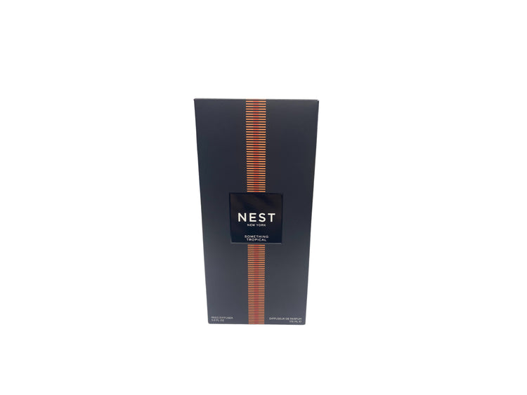 Nest New York Something Tropical Reed Diffuser in a black box with orange striped accents.