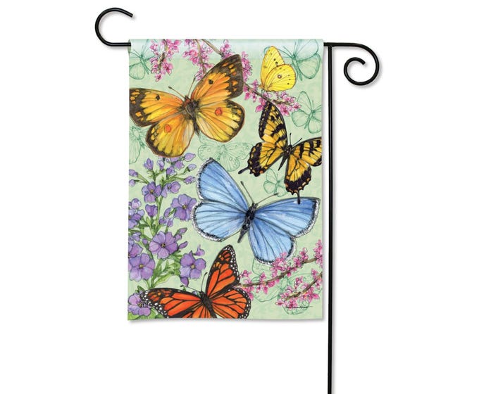 Garden flag with a light green background featuring a watercolor illustration of various butterflies and purple flowers.