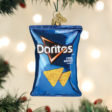 Glass Christmas ornament shaped like a blue bag of Cool Ranch Doritos chips hanging on a tree.