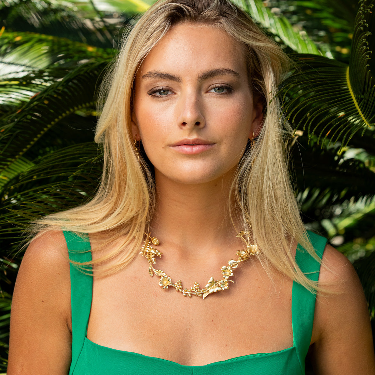 Gold plated brass necklace featuring a meadow wildflower pendant on an 18-inch chain.