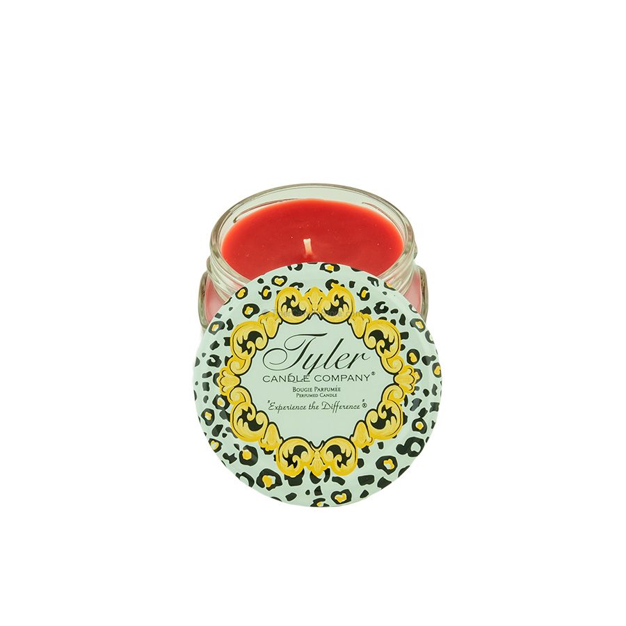 Tyler Candle Company 3.4oz candle with red wax and a leopard print lid featuring gold scrollwork.
