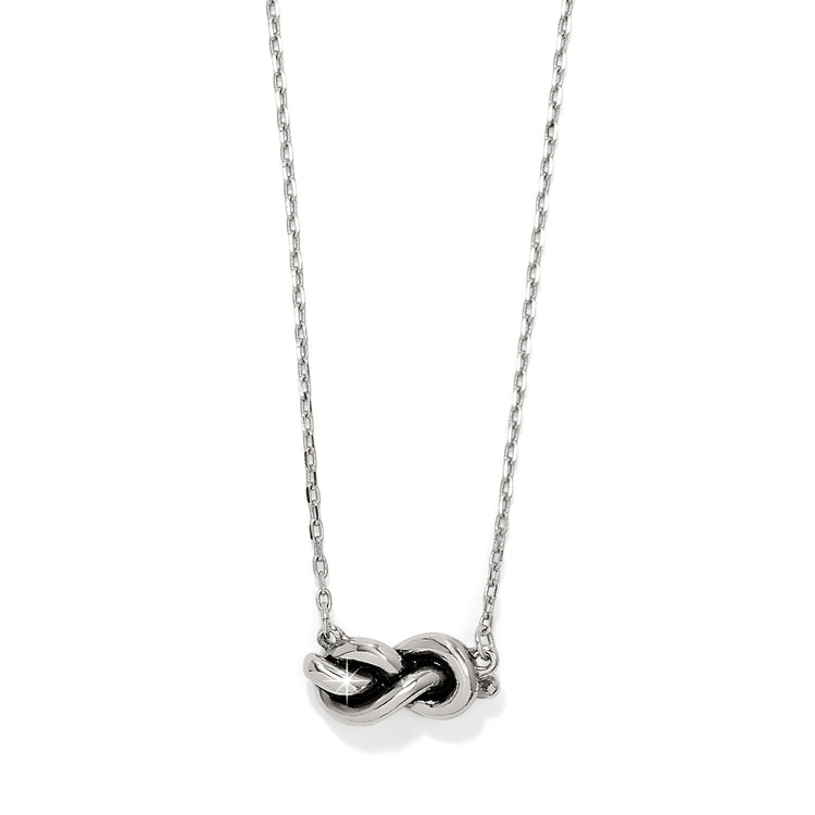 Interlok Single Knot Petite Necklace in silver with an adjustable chain and lobster claw closure.
